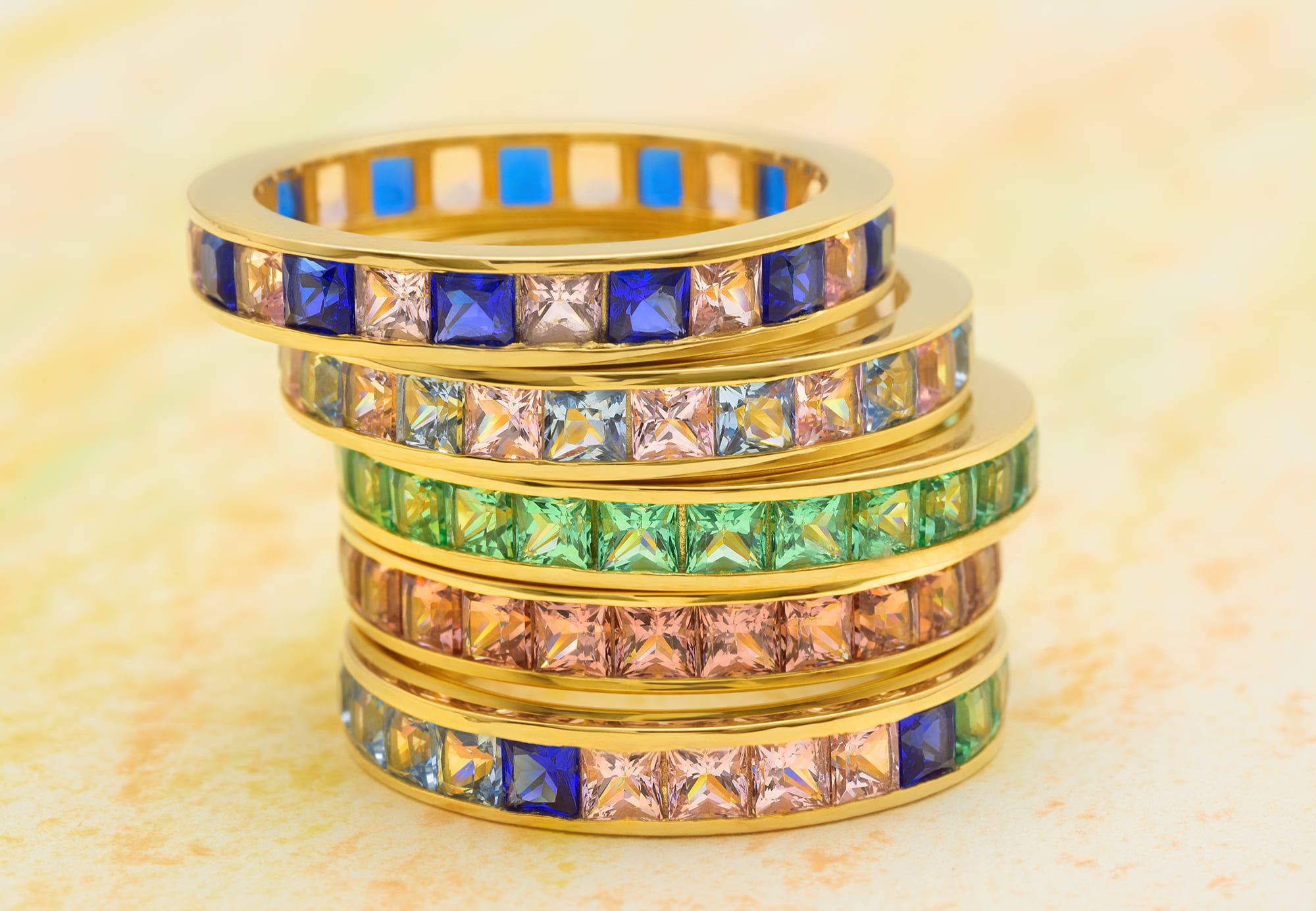 Stack these colorful eternity bands with Siamite gemstone reflections to get your own palette.